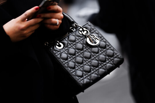 Milan, Italy - January, 24, 2024: woman wears Dior Lady bag, street style details, fashion outfit detail.