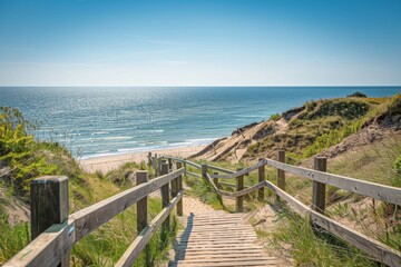 Fototapeta na wymiar Serene wooden walkway leading down to a bright sunny beach with clear blue skies