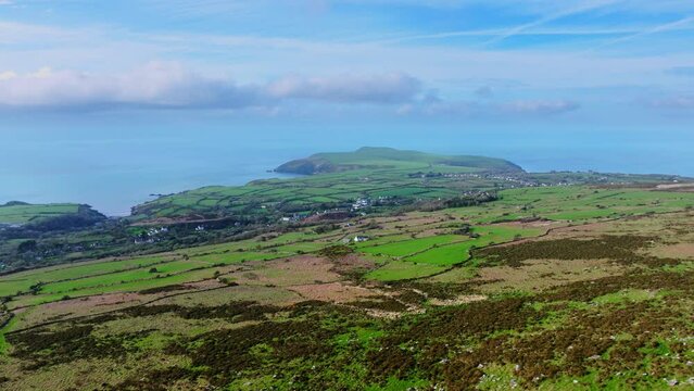Aerial shot of rugged rural landscape and coastline in West Wales, near Fishguard.