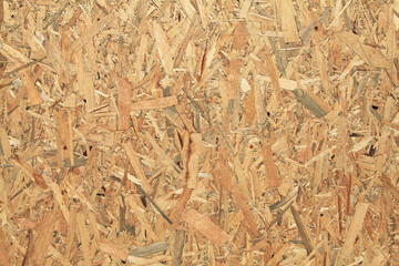 Wood (wooden) surface, texture, background. Building board made from pressed wood chips. A wall...