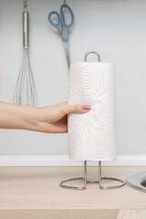 man putting paper towel on kitchen counter