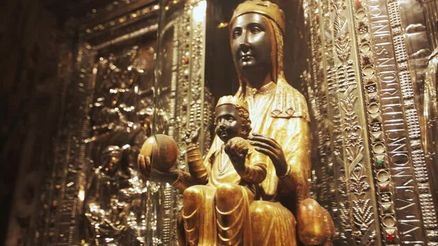 The carved sculpture of Madonna - Nuestra Senora de Montserrat in the chruch Iglesia de Belen. Black Madonna in Montserrat Monastery, Spain, Catalonia.