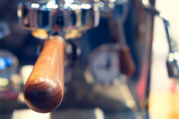 A wooden handle of a coffee maker