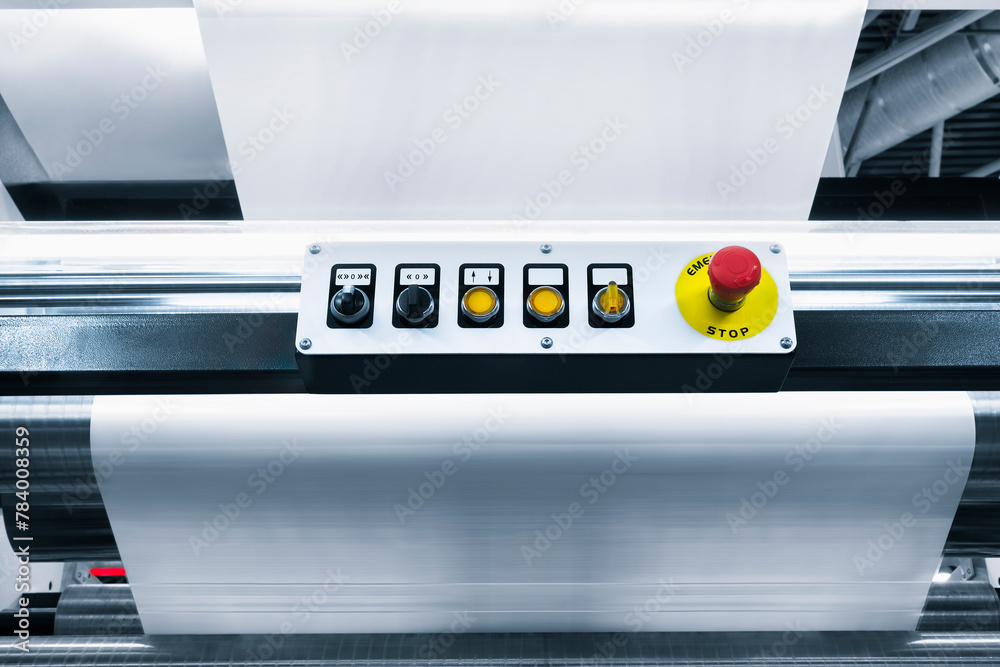 Poster A machine with a red button and yellow buttons. The buttons are numbered 1 through 5. The machine is used to print paper