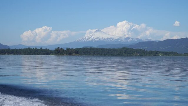 Video from a boat on the lake overlooking the volcano in southern Chile on a summer day.
