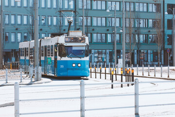 City blue tram on a sunny street . Modern transport and travel concept. Gothenburg, Sweden