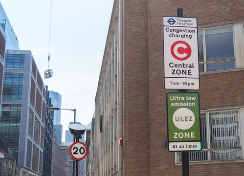 Congestion Charge and ULEZ Sign on a post at the side of a London road. London - 11th August 2020