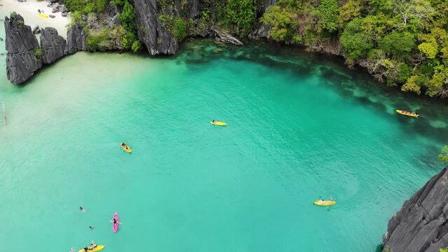 Yellow kayaks in turquoise clear water