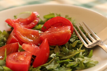 Arugula salad plate with tomatoes