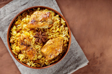 Traditional Chicken Biryani Bowl on Linen Napkin, Copy Space, Top View