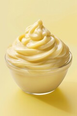 A bowl of mayonnaise on a bright yellow background. Perfect for food and cooking-related projects