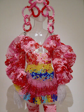 Kevin Germanier: Embroidered Alien, recycling of 3 silhouettes, 2022. Upcycled plastic beads from Hong Kong, fishing line.