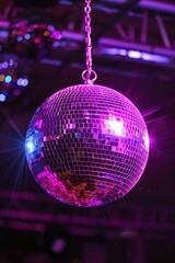 Obraz premium A shiny disco ball hanging from a chain. Perfect for party invitations