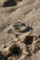 Obraz na płótnie Canvas Wedding rings on sandy beach, perfect for wedding concepts
