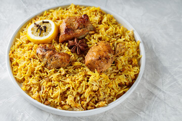 Plate of Traditional Chicken Biryani on gray background, Indian Cuisine Concept