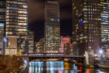 City of Chicago downtown and Chicago River sunset night Illinois USA.