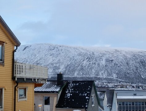 Close-up of the Tromsdalstinden mountain as seen from Tromso in January.