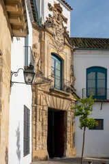Facade of a beautiful ancient building in Cordoba, Andalusia, Spain.