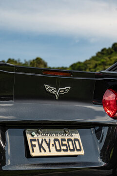 Black Chevrolet Corvette rear end badge focused shot - Sky background - High Resolution Image of an american muscle car