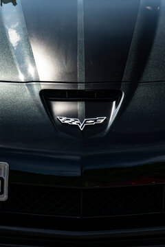 Black Chevrolet Corvette front badge, GM SportsCar front end logo close up view - High Resolution Image