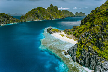 Limestone karst cliffs of Matinloc and Tapuitan Islands and straits between at Palawan, Philippines