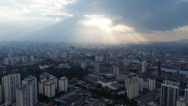 The sunset in São Paulo is a breathtaking spectacle, especially when viewed from an aerial perspective. The vibrant colors of the sky blend with the city's skyscrapers, creating a stunning urban lands