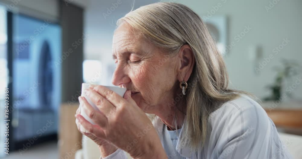 Poster Senior woman, coffee and thinking on couch with smell, aroma and smile for memory in living room. Mature person, happy and relax on lounge sofa with tea cup, latte or drink for morning in retirement