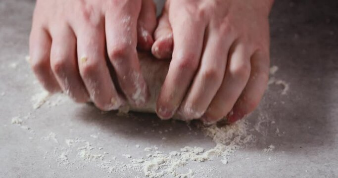 Chef Kneading Pizza Dough on a Floured Surface