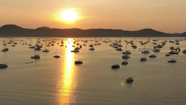 View of the bay with boats, dawn, aerial video from a drone