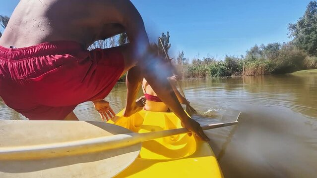 Boat, canoe and couple on river in nature for holiday, summer vacation and weekend outdoors. Water sports, kayaking and man and woman on fun adventure for content creation, vlog and travel influencer