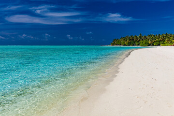 White sandy beach in Maldives with amazing blue lagoon
