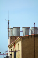 Urban view of rooftop water tanks