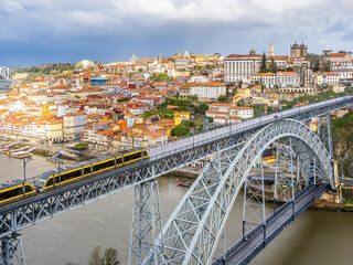 Aerial view of Luiz I bridge at cloudy morning, Porto