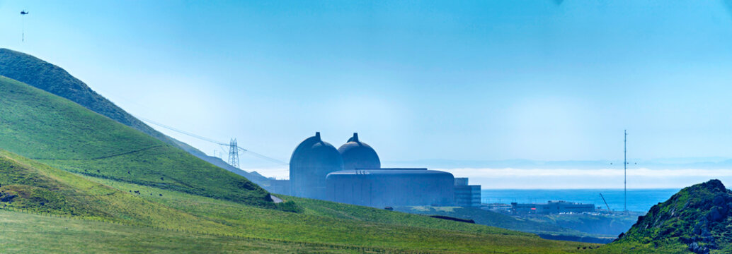 Nuclear power plant with rolling green hills