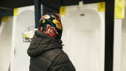 Household Repairs: Join the older woman on her mission to find the right equipment for bathroom and toilet repairs, exploring the department shop with a keen eye for quality and functionality.