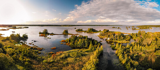 The beautiful panoramic view of the sea with green vegetation against the blue sky. Sweden.