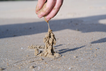 Playing sand tower at the beach
