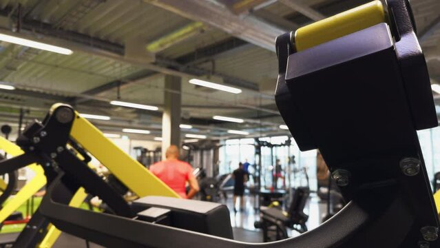 Gym Machinery Mix: Dive into a city gym boasting a mix of modern exercise equipment machines, offering endless possibilities for customized fitness routines.