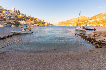 Fishing boats in the village of Symi at sunset.