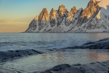 Sunset over the sea by the mountains
