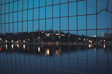 View of a fences in front of a cityscape