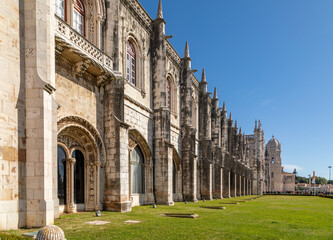 Fototapeta premium Long White LimeStone Facade of Mosteiro dos Jeronimos Monastery, Lisbon, Portugal