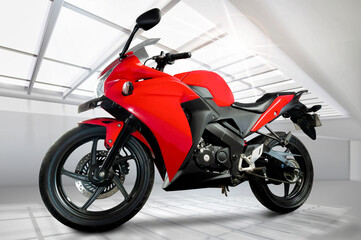 full side view of red sports type motorbike with fuel injection system, 250 cc engine,