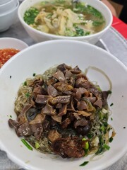Mien Ngan Xao or stir-fried glass noodles  with muscovy duck meat, a famous dish in Hanoi, Vietnam.

