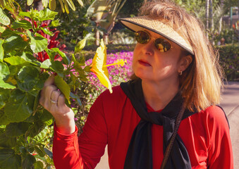 Woman enjoys Hawaii flowers