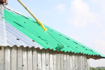 Paint on the roof with a brush
