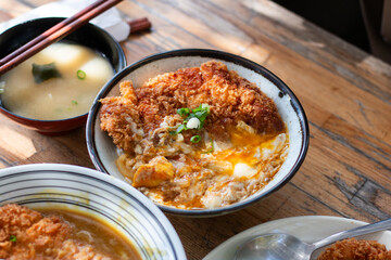 Close up homemade Katsudon serve on wood table
