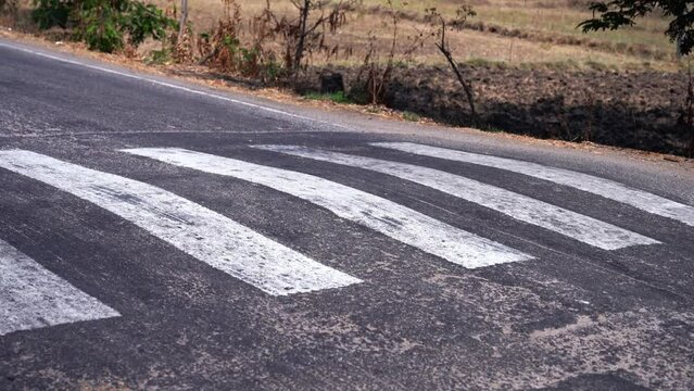 Speed bump on empty street. Road rules