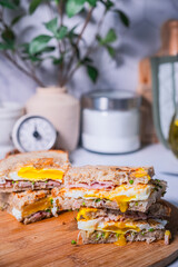 The delicious sandwich on the kitchen top. Homemade healthy meal and cooking concept.