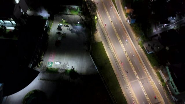 View of the Banjarmasin city and Alalak River Bridge or Basit Bridge from a drone during the night